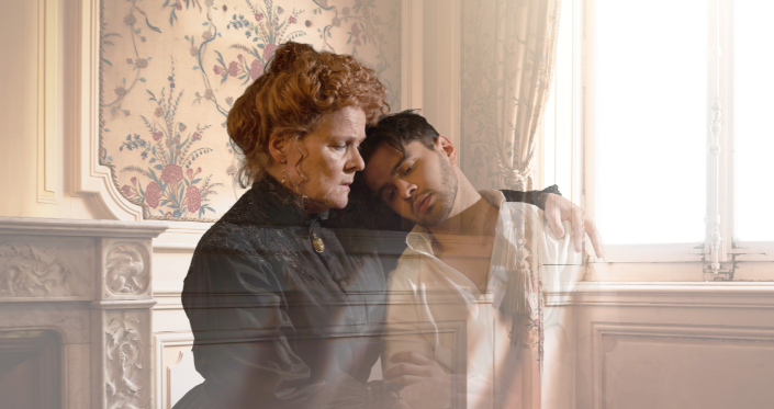 A mother comforts her son, both are fading away; light streams through the window in a stately room